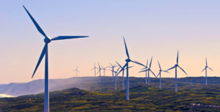 Image of coastal wind power generation, reflecting Lacima's renewable energy valuation and risk analytics solutions
