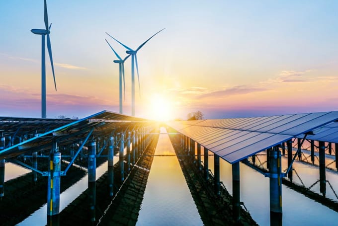 Image of a wind and solar power generation farm at sunset, reflecting Lacima's capabilities in renewable energy valuation and risk analytics